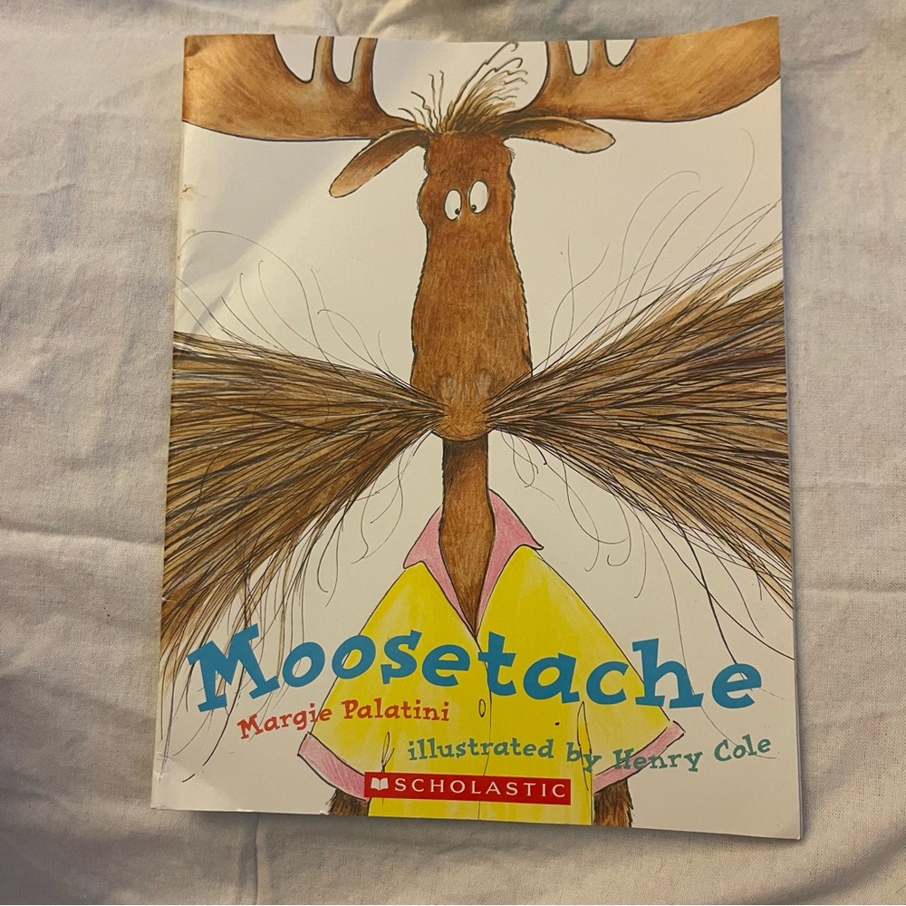Scholastic Moosetache Book with Blue and Yellow Cover